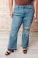 Isla Mid Rise Distressed Released Hem Bootcut Jeans - Loving God